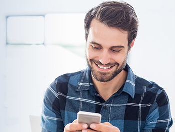 man using an online dating  site with his phone