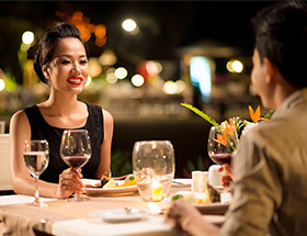 Attractive couple having dinner