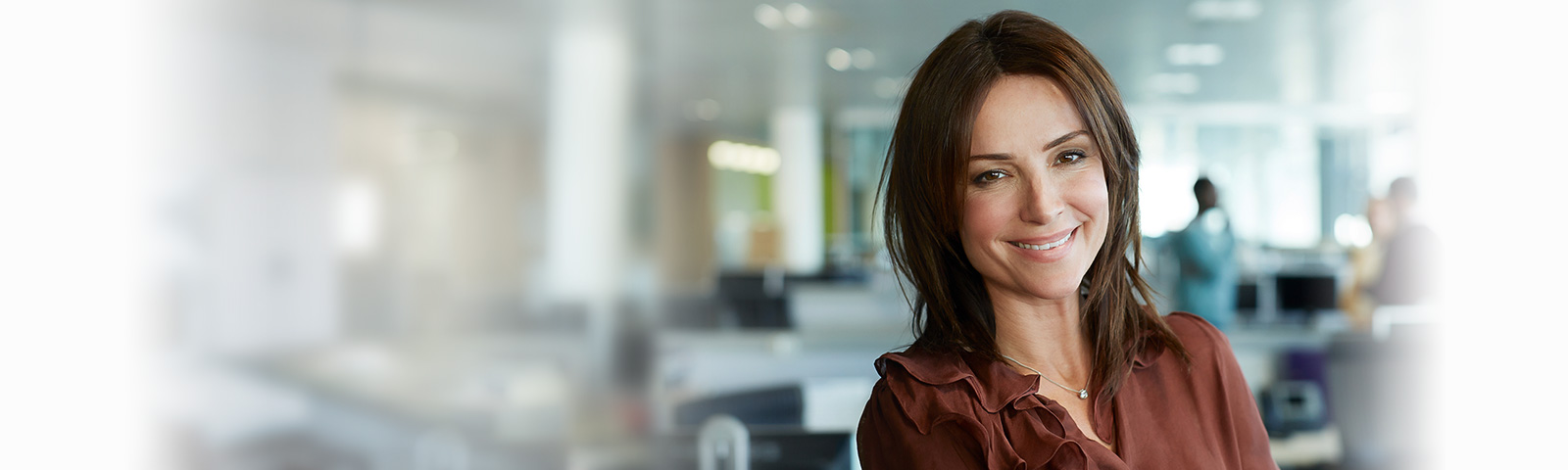 single woman smiling in office