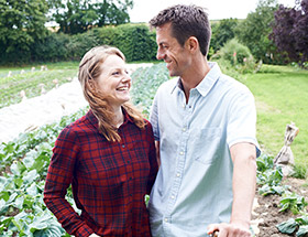 Farmer couple hugging