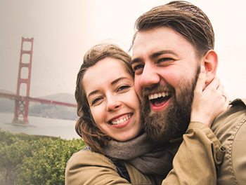 San Francisco Couple hugging at the Golden Gate Bridge