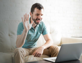 man Skyping his partner