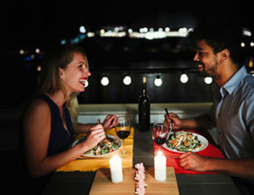 couple sitting in rooftop restaurant