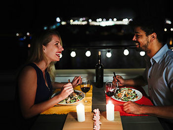 couple sitting in rooftop restaurant