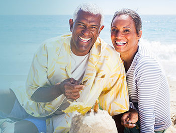 Couple laughing together on the beach