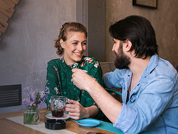 Couple deciding who should pay on their first date