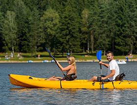 Couple out on the water in canoes