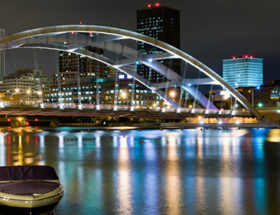 Night scene in Rochester with bridge and boat