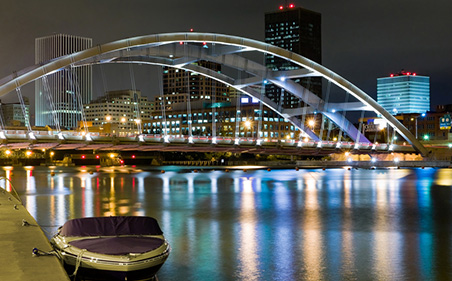 Night scene in Rochester with bridge and boat