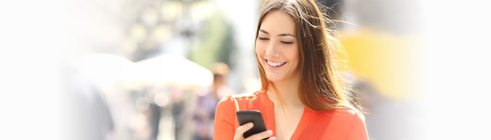attractive woman smiling with phone