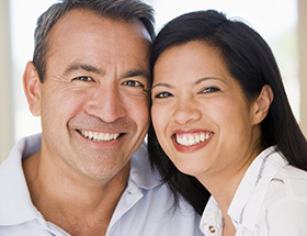 Happy Asian couple smiling