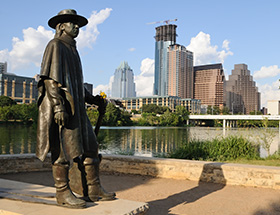 Statue of Stevie Ray Vaughn looking out across Austin
