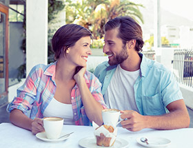 Couple outside at a cafe in the summer