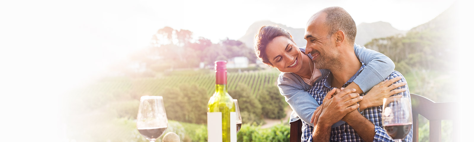 relaxed couple outside with wine