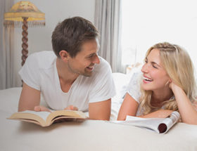 Couple talking and bonding on the bed