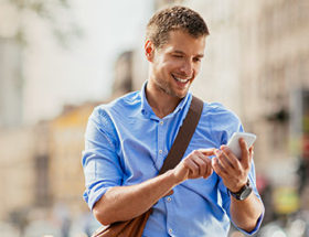 Man using his smartphone to try out a dating app