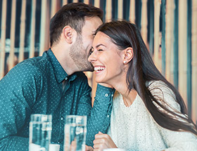 Couple making each other laugh
