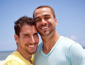 gay couple on beach LGBT dating