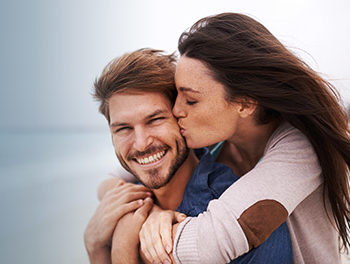 Couple kissing on a beach