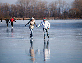 couple ice skating holding hands