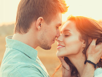 couple on beach about to kiss