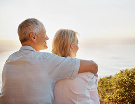 older couple looking out to sea