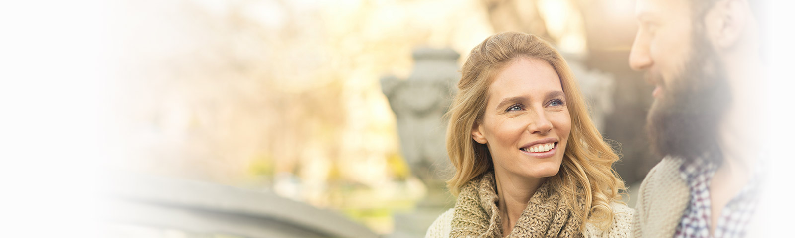 Beautiful woman smiling at man