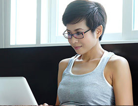 intelligent looking woman with laptop