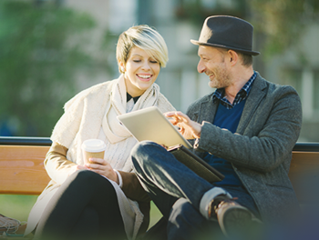 man and woman sat on a bench