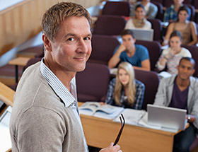 Man in front of an academic classroom