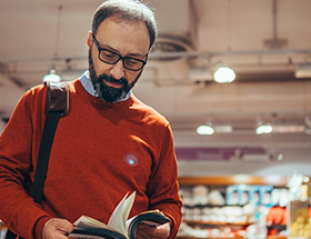 man reading a book about childfree dating