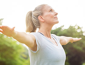 older woman doing yoga thinking about childfree dating