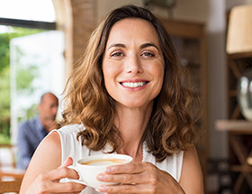 Smiling woman on a coffee date