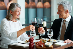 Attractive older couple enjoying a meal in a restaurant