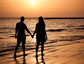 mindful couple on the beach