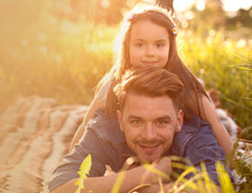 dad and child in a field