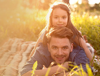 dad and child in a field