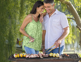 Couple having a summer cookout together