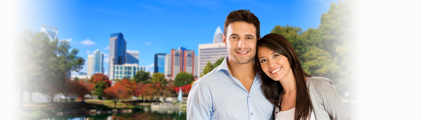 couple with charlotte skyline background