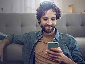 single man happy after asking someone out over text