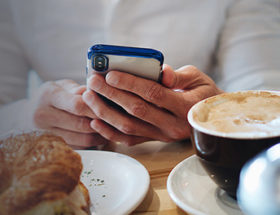 man reading dating tips for busy professionals on his smartphone