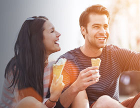 handsome man talking to a girl and making her laugh