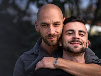 Two handsome gay guys in a new relationship