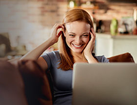 Woman saying hello to her long distance Valentine's Day date via a video chat